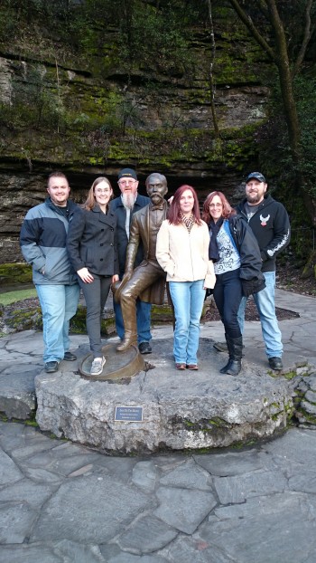 Posing with a larger than life statue of Jasper Newton "Jack" Daniel in front of the natural, limestone filtered spring they still get water from today.